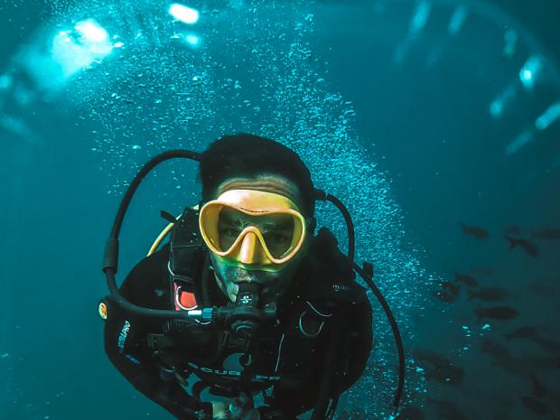 Andre Castaneda swimming towards the camera